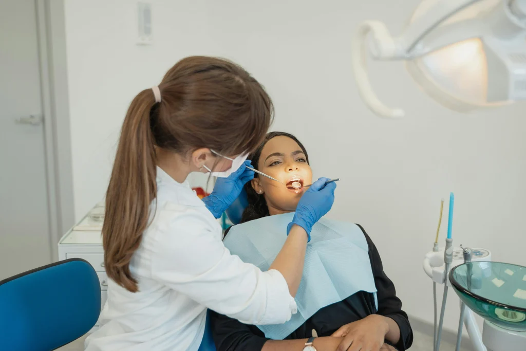 Dentist examining a patient during a dental check-up.