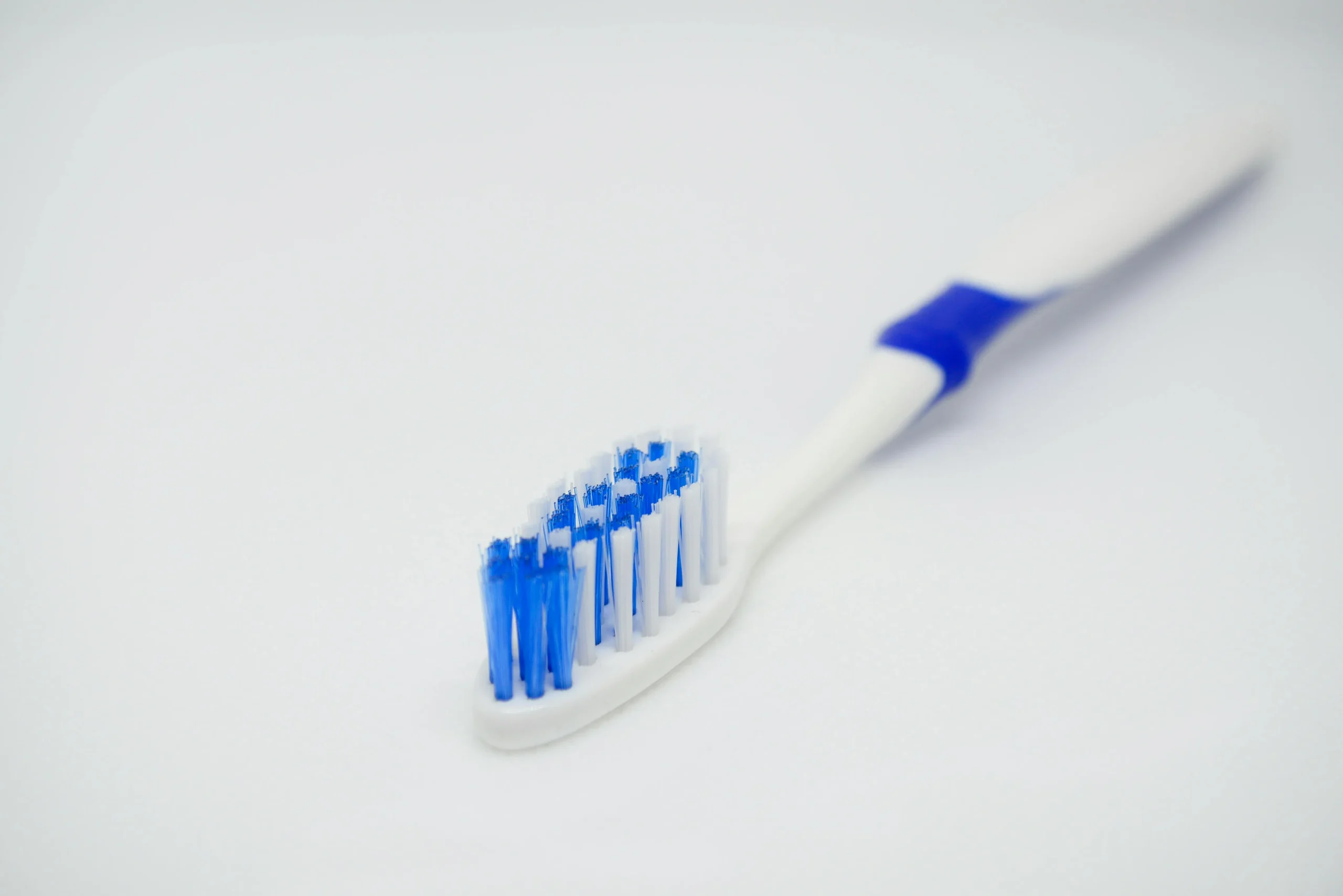 Soft toothbrush suitable for gently cleaning a dental mouth guard.